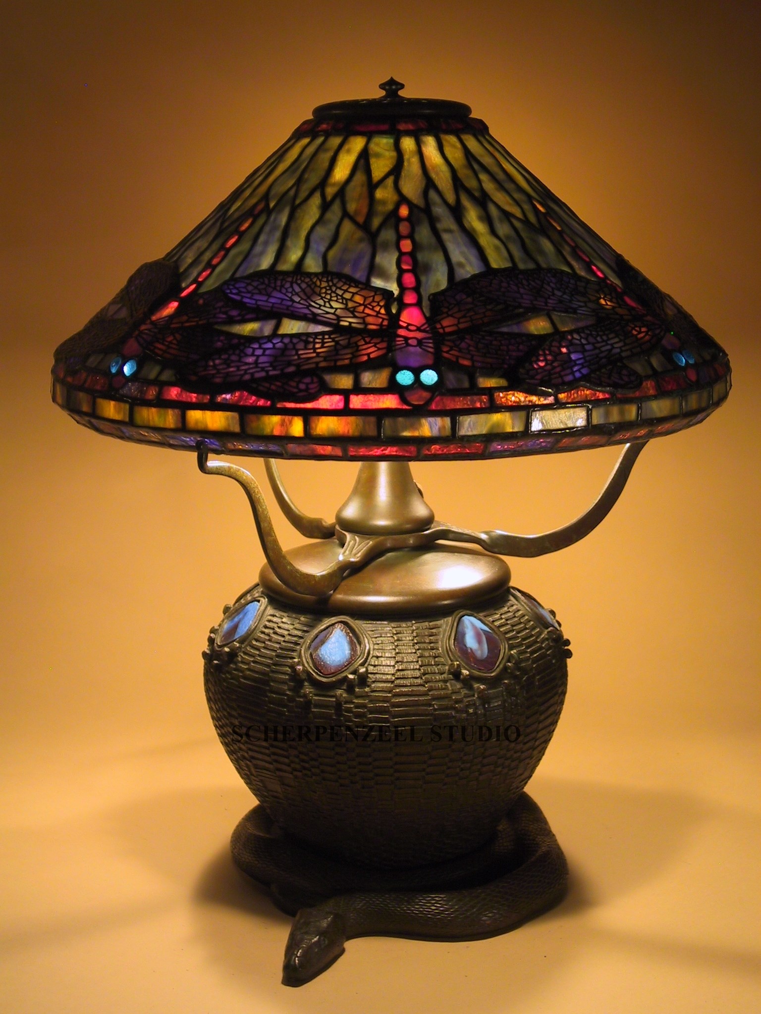 Dragonfly on snake and basket base