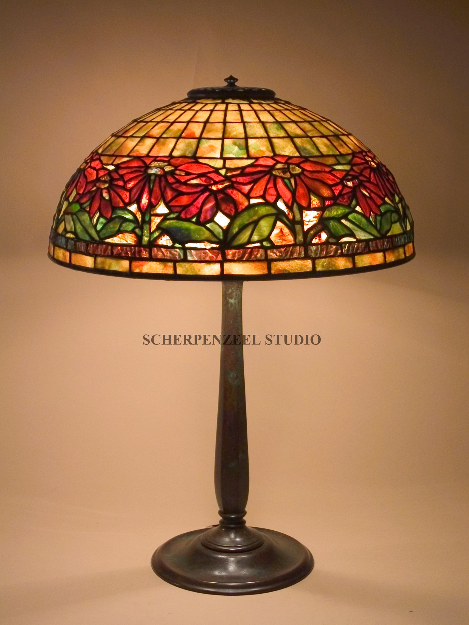 Poinsettia on round stick base