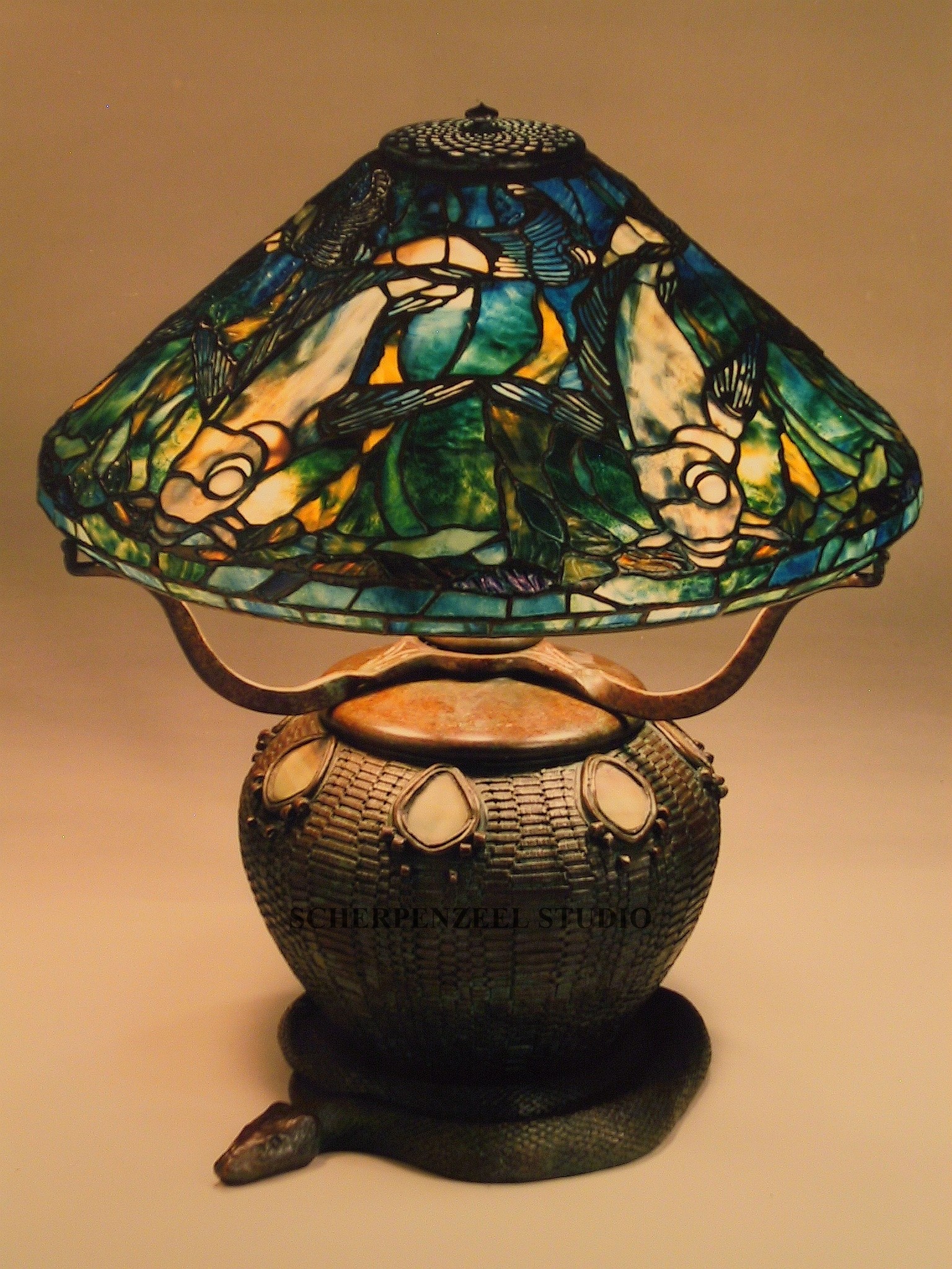 Fish on snake and basket base