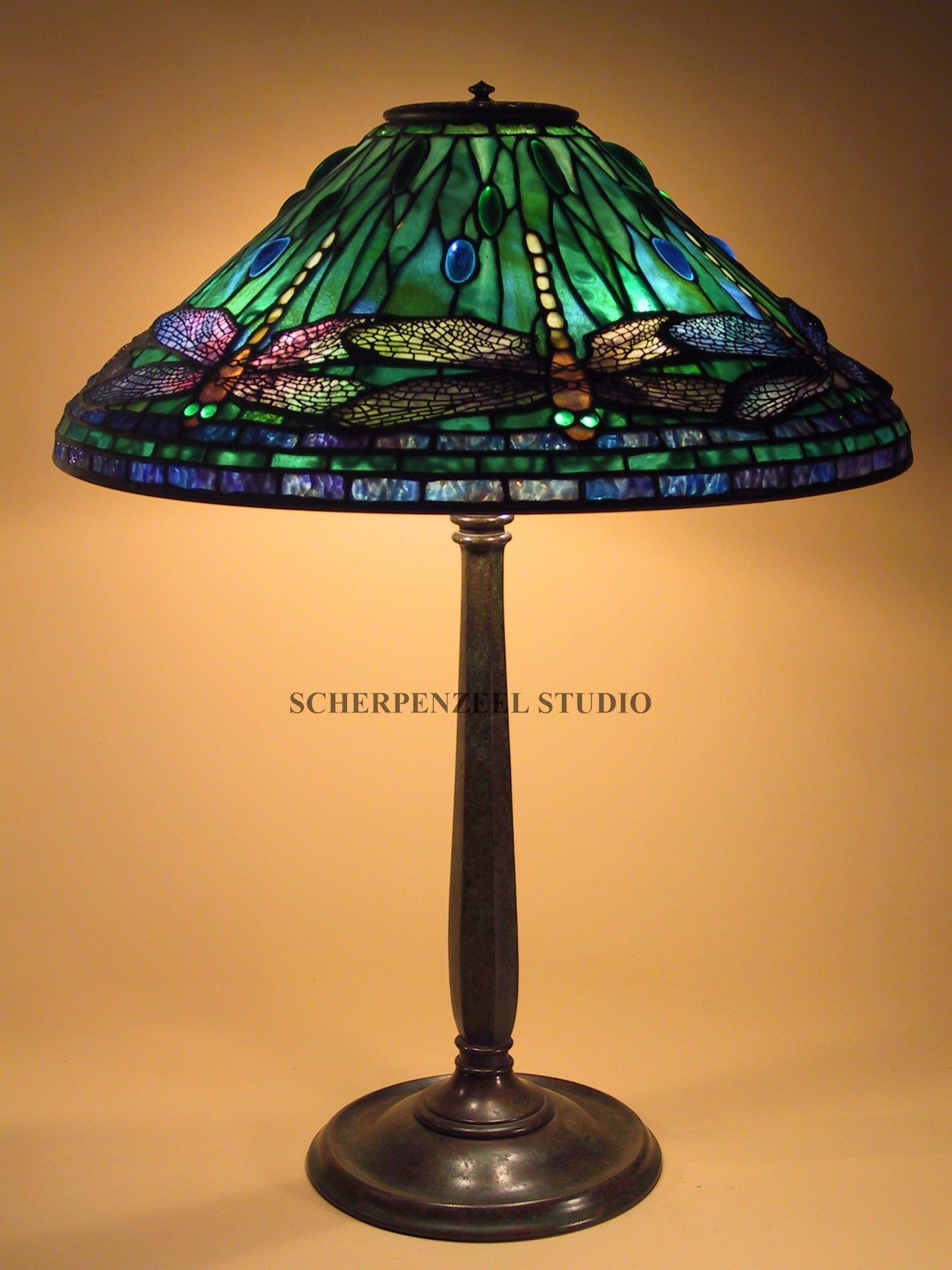 Dragonfly on round stick base