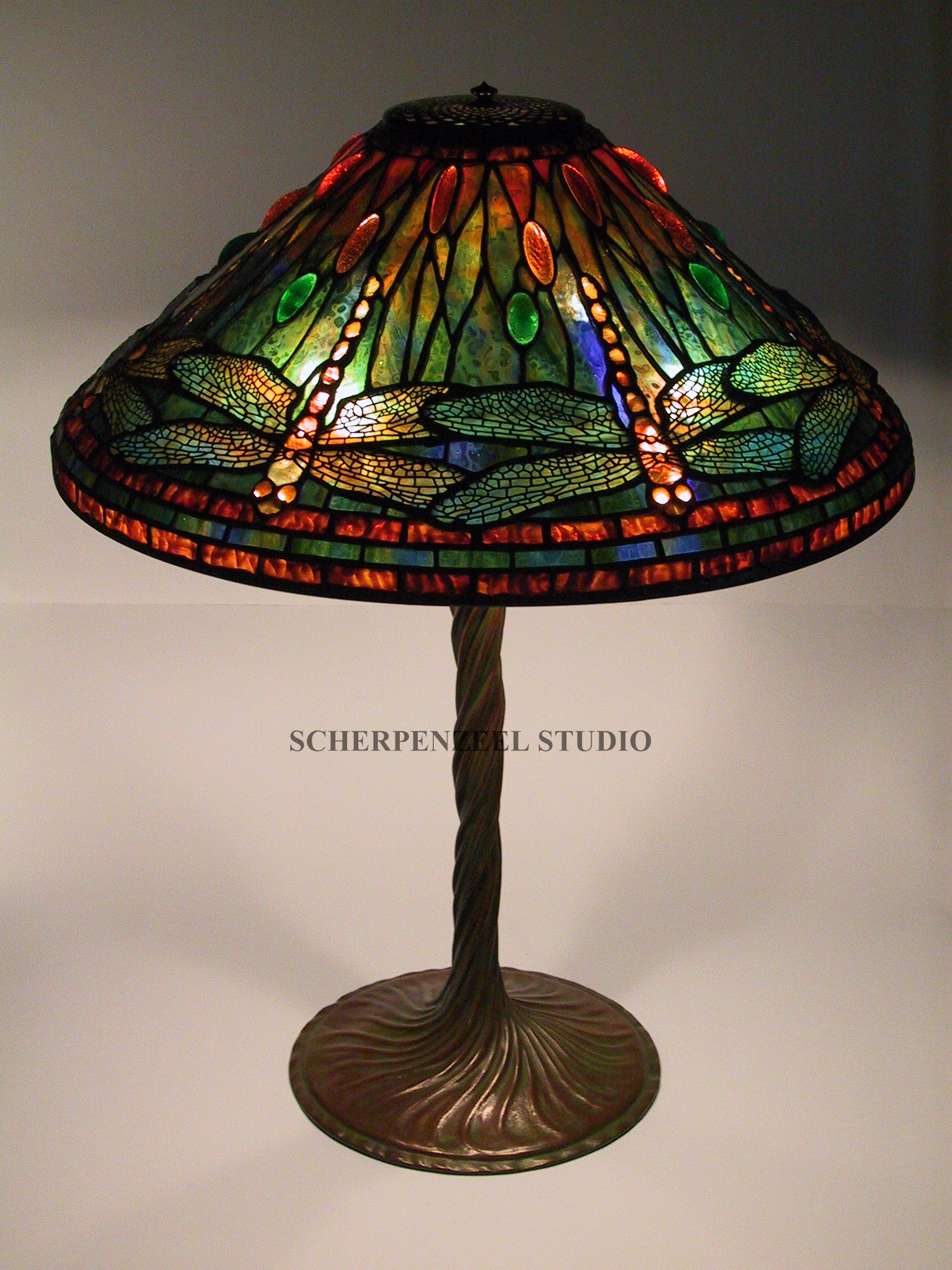 Dragonfly on twisted vine base