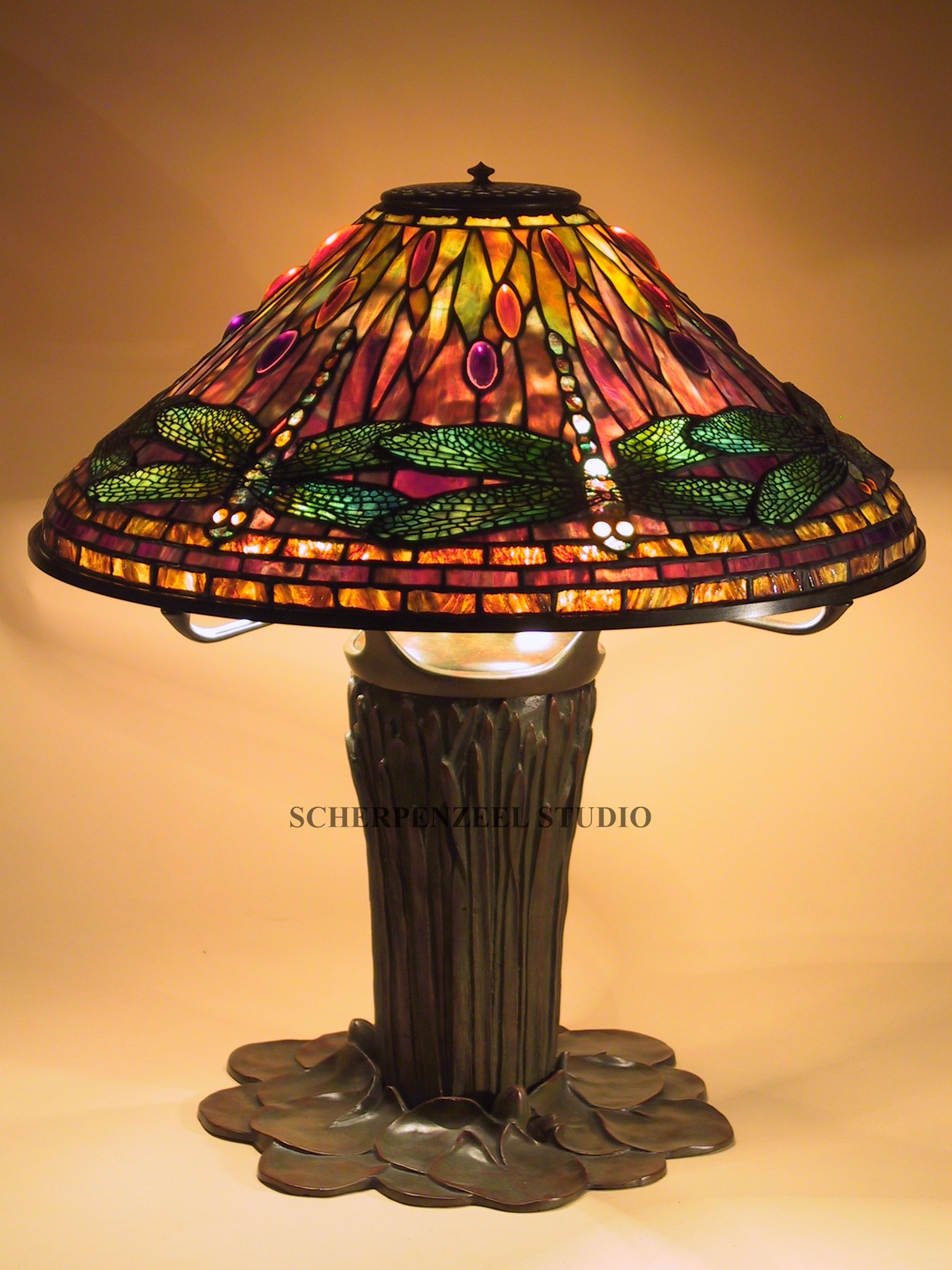 Dragonfly on cattail base